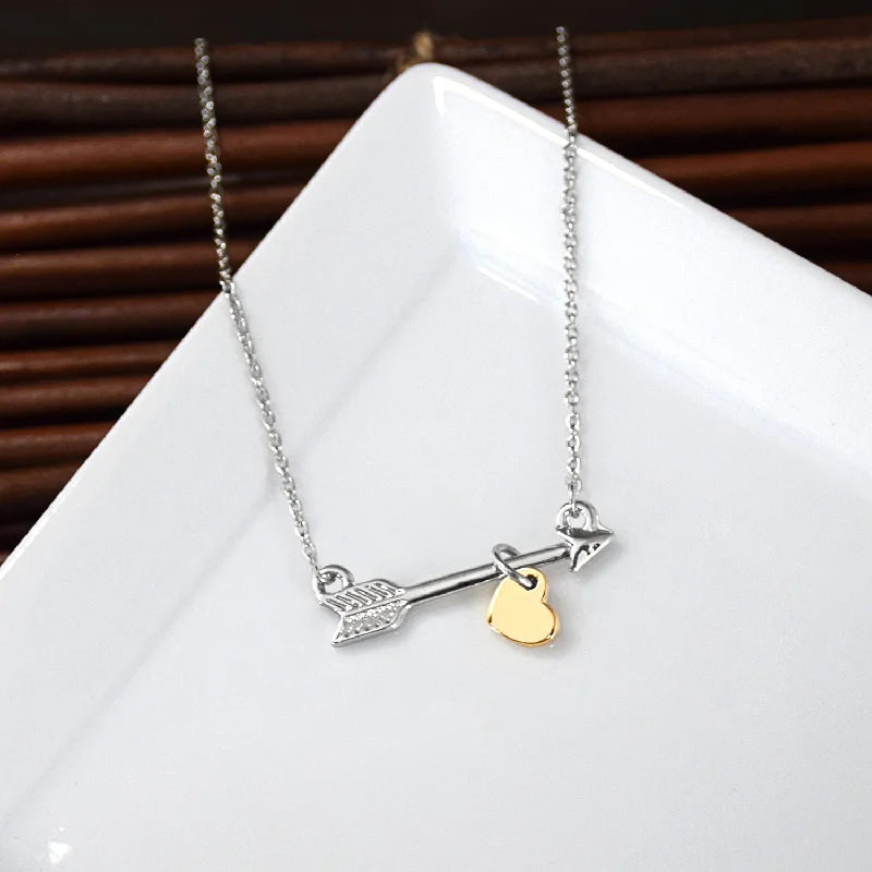 Pearl cluster necklaces-Go Confidently Arrow Necklace - Silver finish with gold heart charm